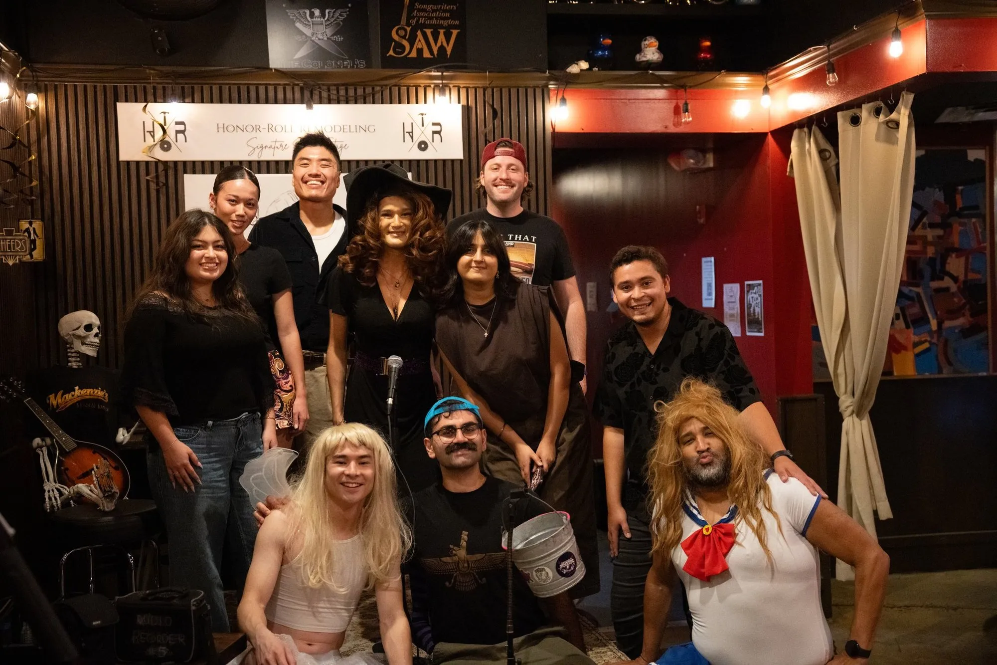 The night's performers posing together on stage